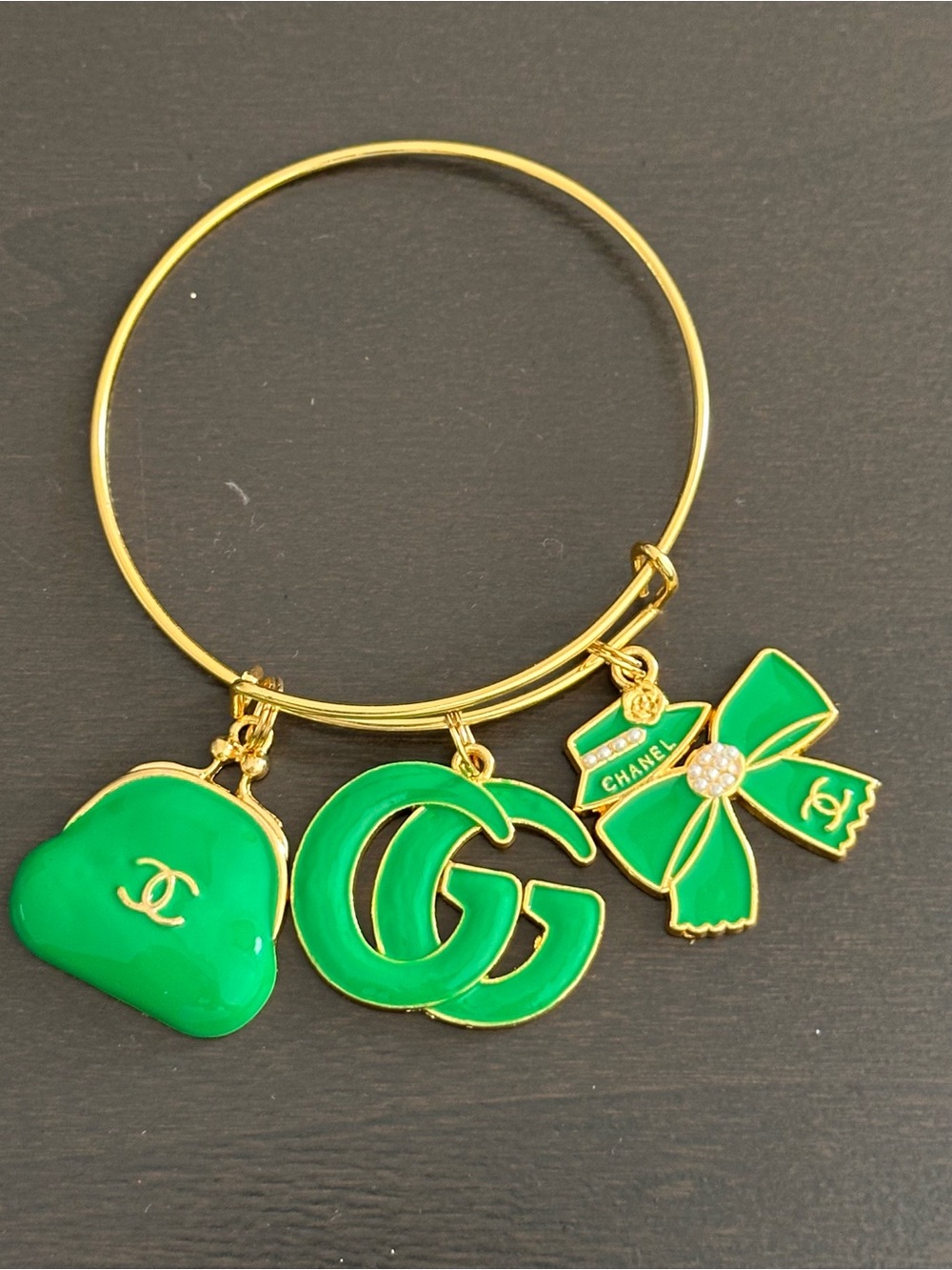 No Boundaries Gold-Tone Bracelet with Green Logo and Bow Charms
